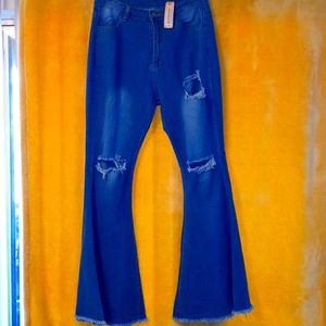 Wide leg (bell bottom) Size Large high rise ripped jeans